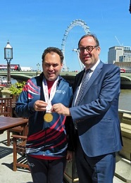 Daniel showing Richard his gold medal
